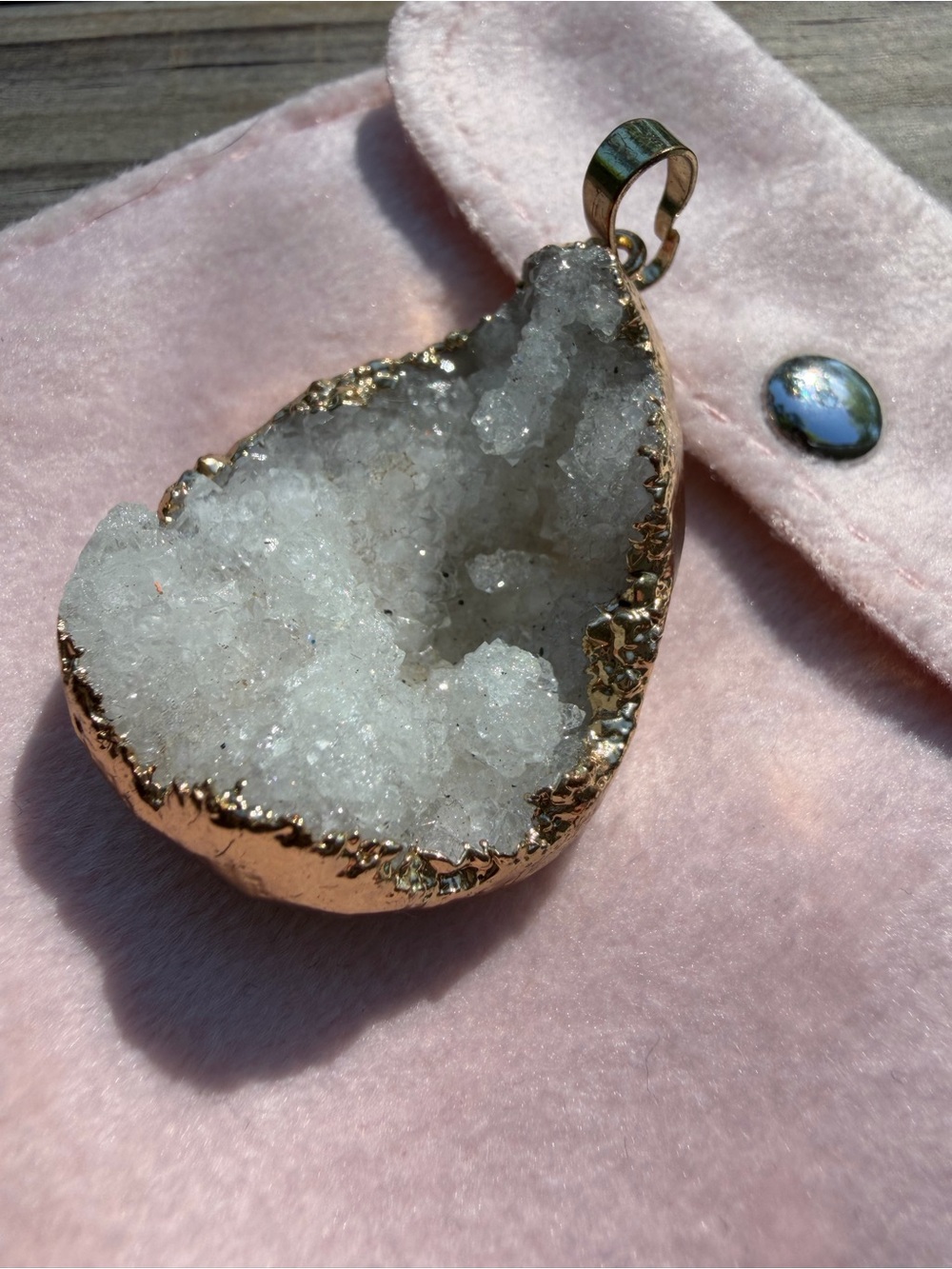 Gold-Edged White Geode Pendant with gold specks with pink felt storage pouch